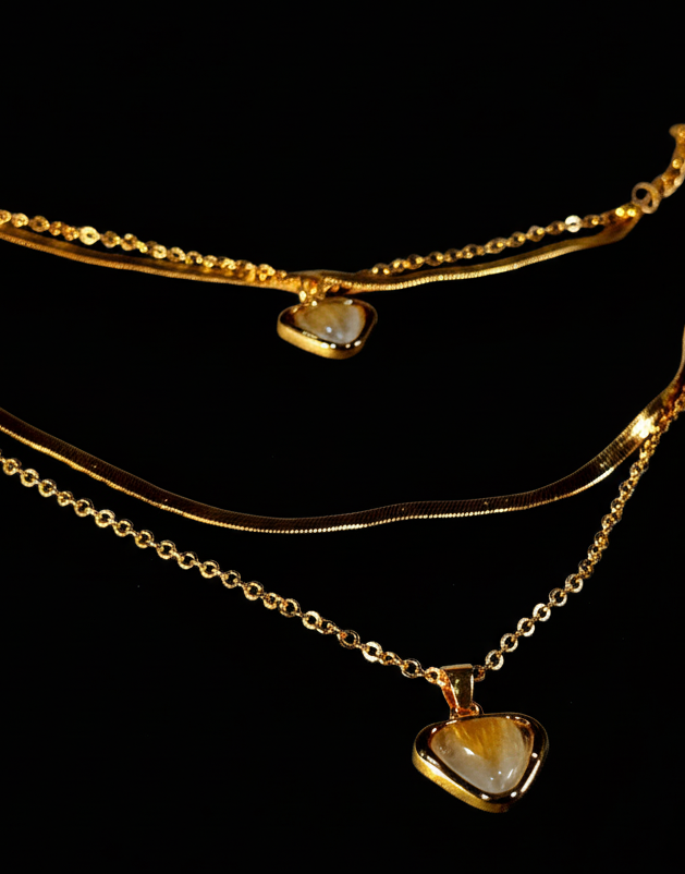 Golden necklace with heart-shaped pendants