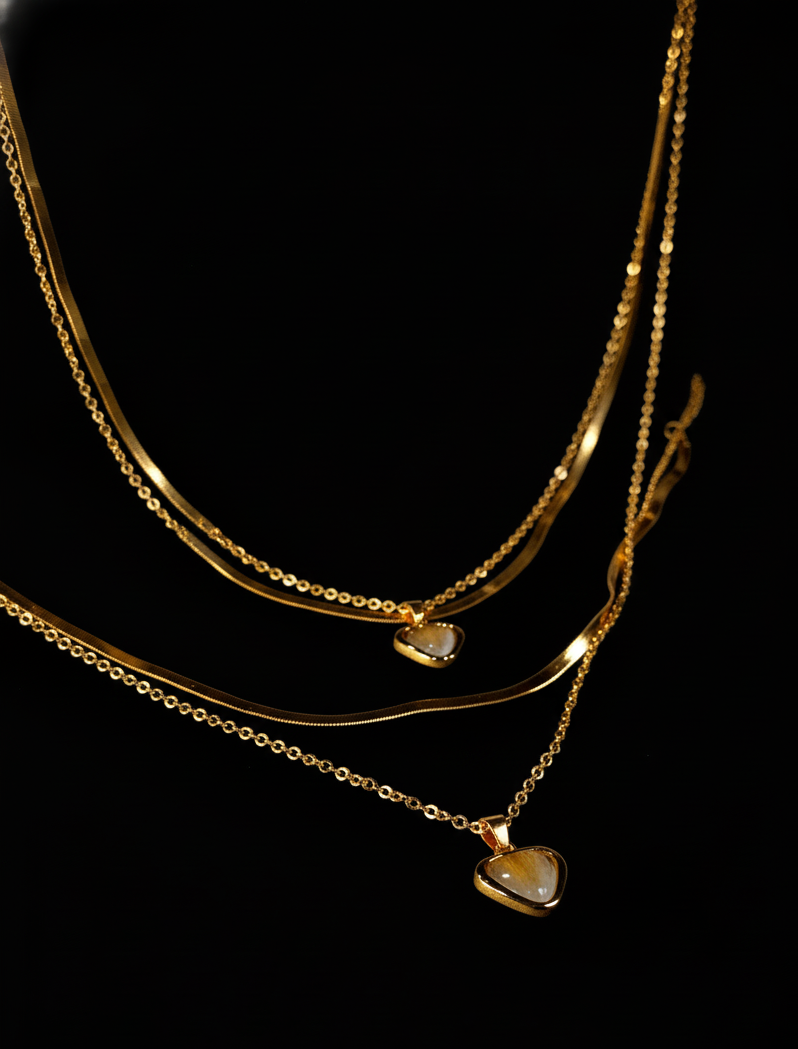Golden necklace with heart-shaped pendants