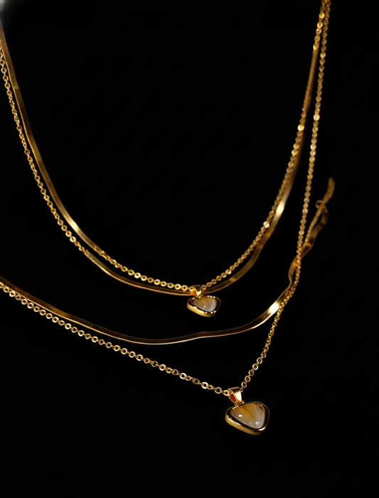 Golden necklace with heart-shaped pendants